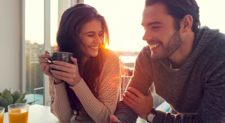A couple enjoy their morning coffee, having decided to do a mortgage recast.