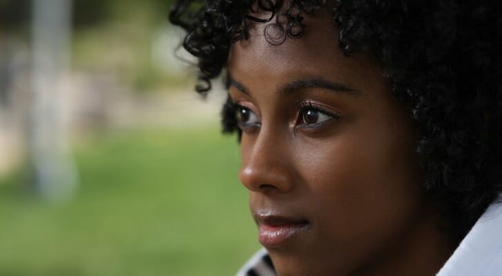 A woman considering the legal rights of a disinherited child.