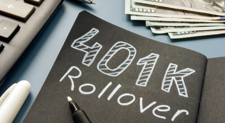 Cash next to a piece of paper that says "401K Rollover."