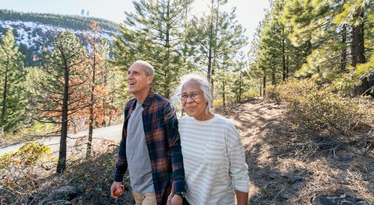 Retired couple walking in the woods