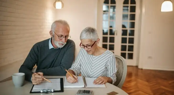 A husband and wife reviewing if they can avoid taxes on an inherited ira.