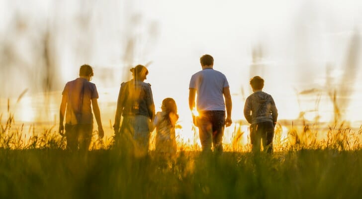 A family watching the sunset.