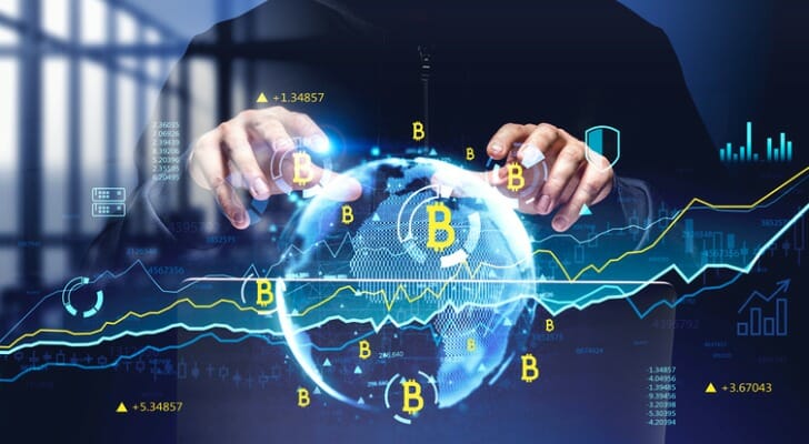 Man's hands over a digital globe