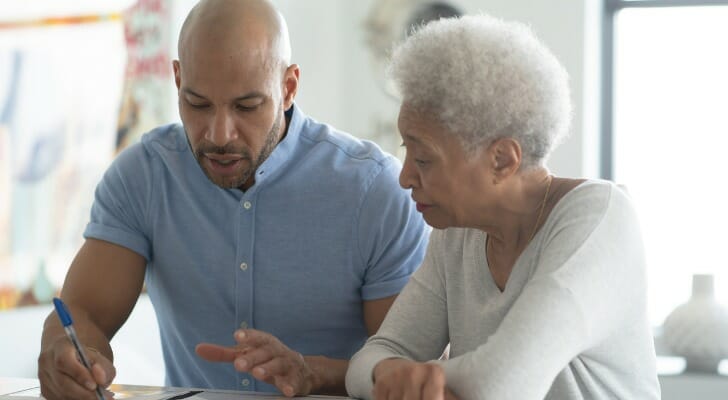 A mother and son going over their family LLC documents.