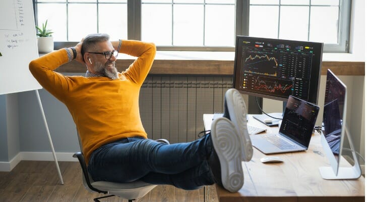 Rich man studies his investments