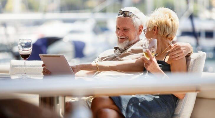 A couple comparing average net worths by age.