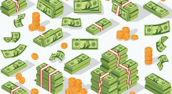 Stacks of cash and coins representing the average net worth of Americans.