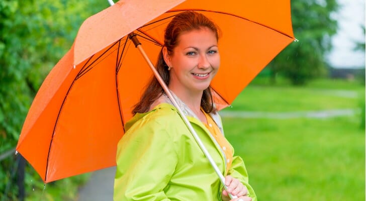 A woman holding an umbrella.