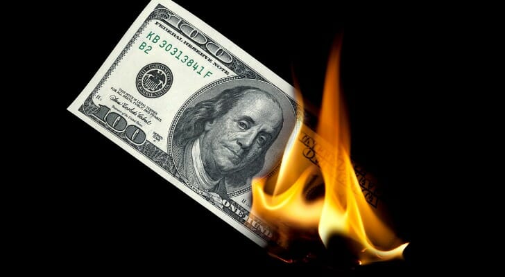 A hundred dollar bill on fire.
