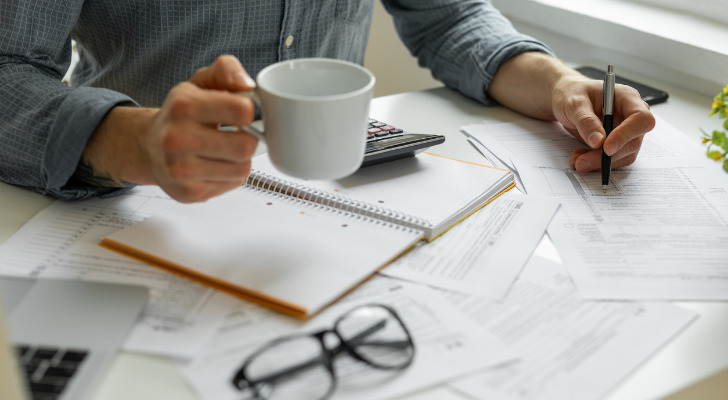 Closeup of an advisor reviewing a portfolio strategy for a client.