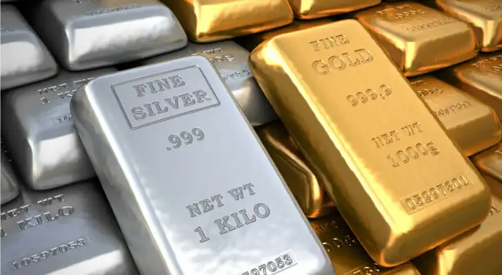 Close up of physical gold and silver bars.