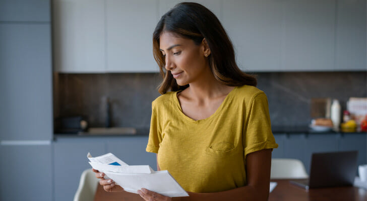 A woman using the envelope saving method.