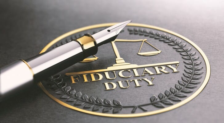 A pen resting on a fiduciary duty logo.
