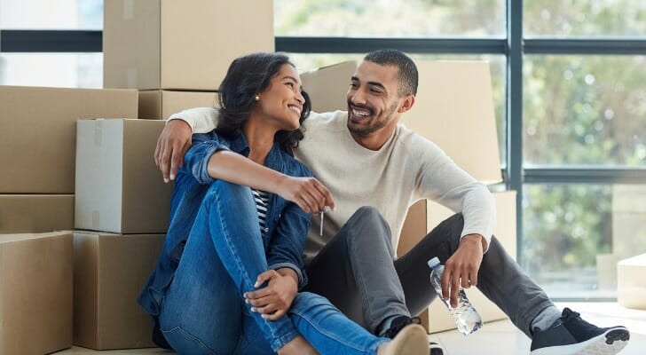 A couple sits in the new home they just purchased. SmartAsset calculated the price-to-rent ratio in 50 of the largest U.S. cities.