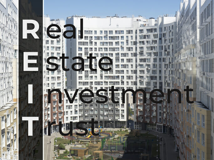 An image of an apartment building, overlaid with the text "Real Estate Investment Trust."