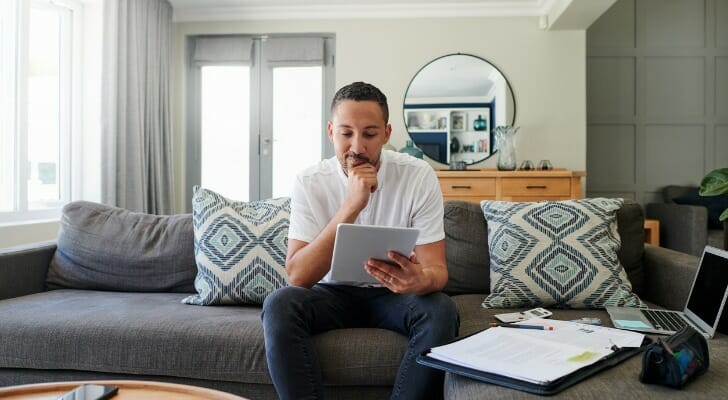 A man reviews his plans for how to invest 200k to make $1 million.