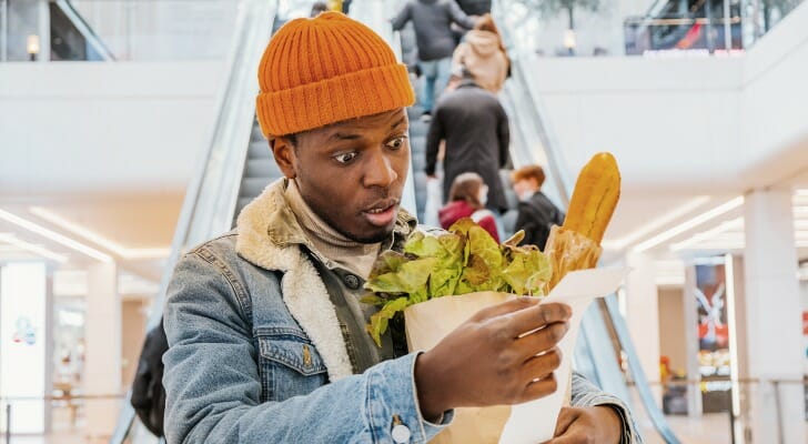 how does raising interest rates help curb inflation