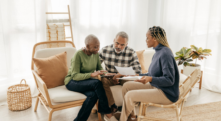 A couple meeting with a CFP®.