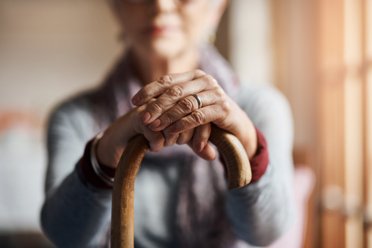 A woman in a nursing home, having learned how to protect assets if a spouse goes into a nursing home.