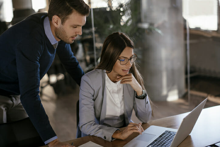 A client reviewing their financial plan with their CRPC.