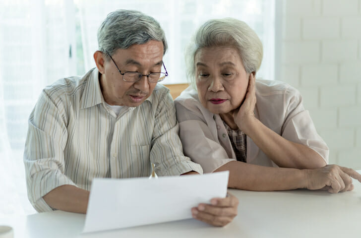 A couple review if a living trust must file a tax return.