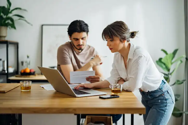 A couple research how to invest $100,000 for passive income.