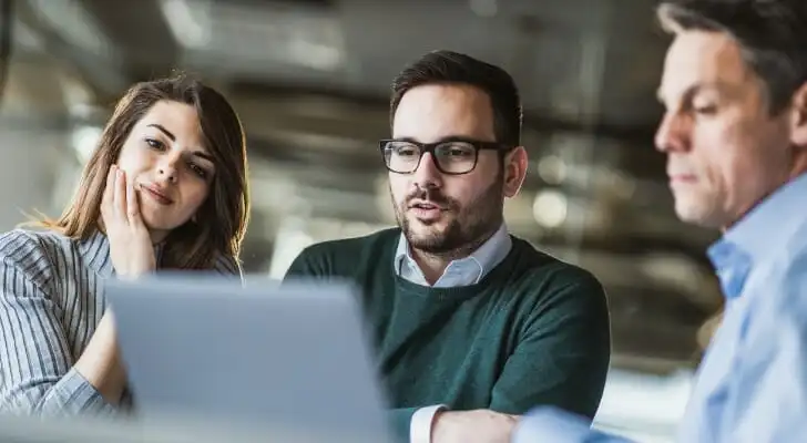 A couple sit down with their advisor to determine how much interest they can earn on $1 million.