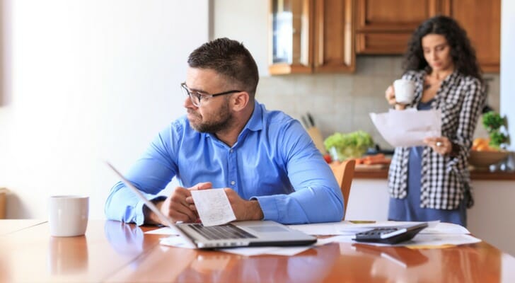 A couple reviewing their finances during a recession.