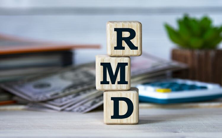 Wooden blocks spelling out "RMD."