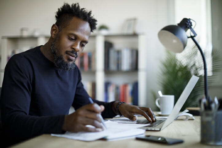 A man reviewing his savings account.