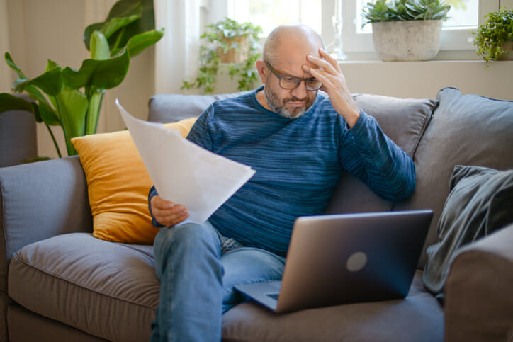 A man researches what happens to interest rates during a recession.