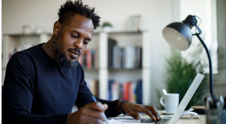 A man reviewing his investment portfolio.