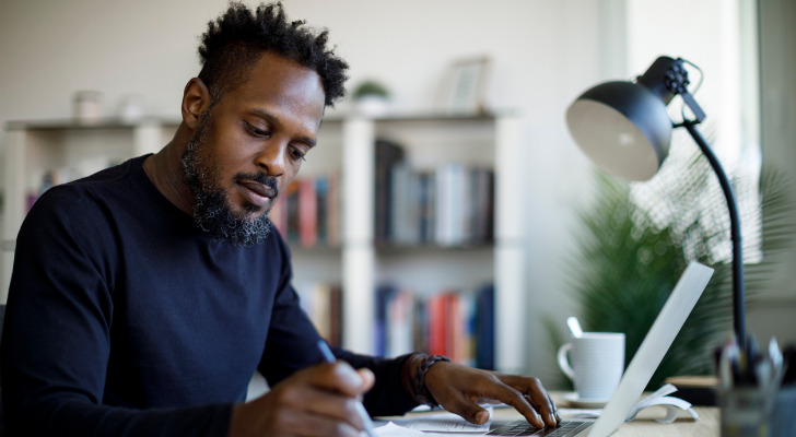 A man reviewing his savings account.