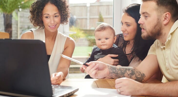 A family working with a financial advisor to set up a family trust.