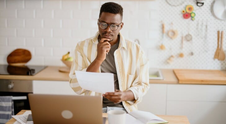 An investor considers using a financial advisor vs. self investing.