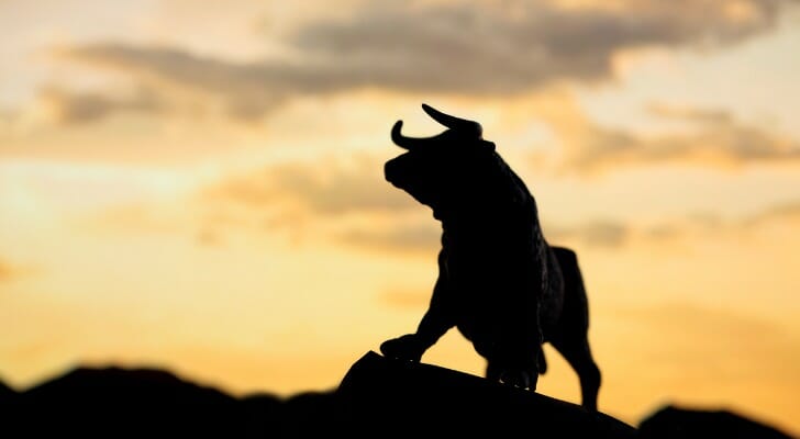 Image shows a pull figurine signifying a bull market. T. Rowe Price says investors should expect lower returns in the midterm.