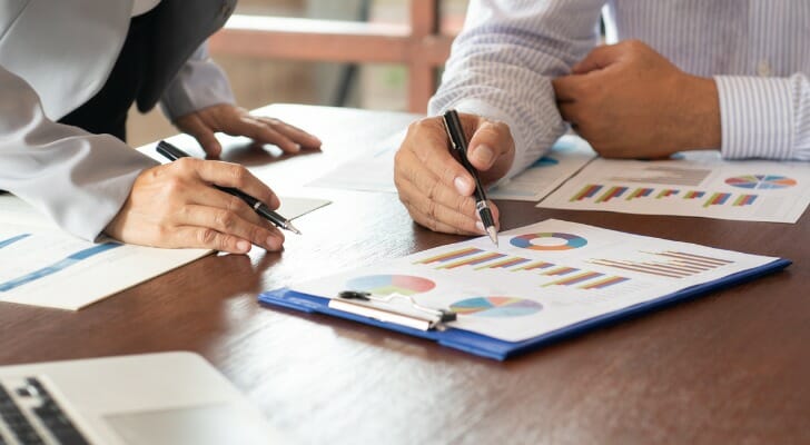 Investors reviewing portfolio performance.