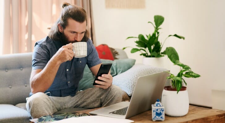 A man sets up a direct deposit into a savings account.