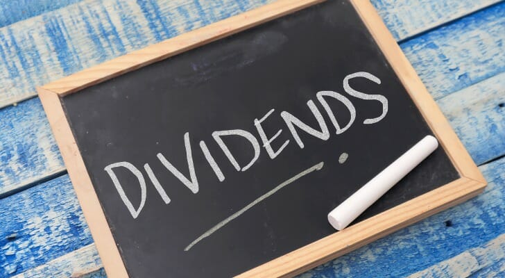 A chalkboard reading "dividends."