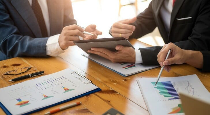 A group of investors drafting an investment plan.