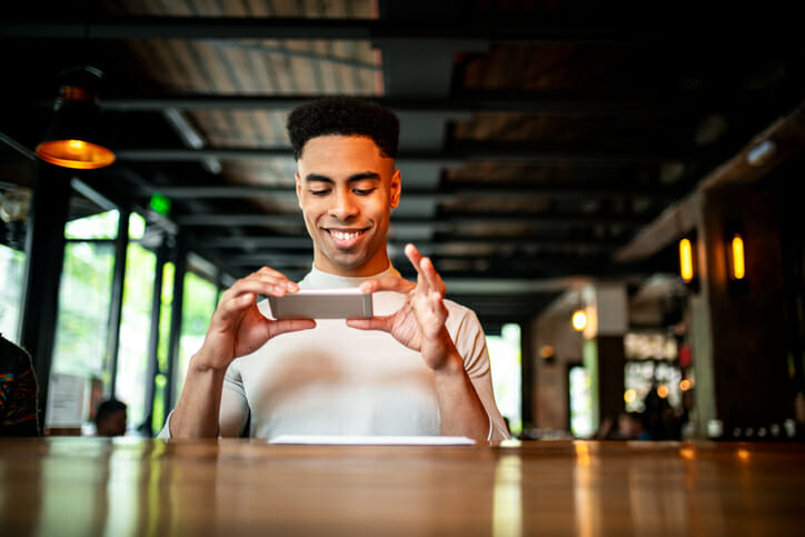 A man depositing a check via mobile app.