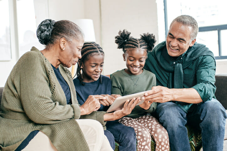 Grandparents reviewing a savings account for their grandchildren.