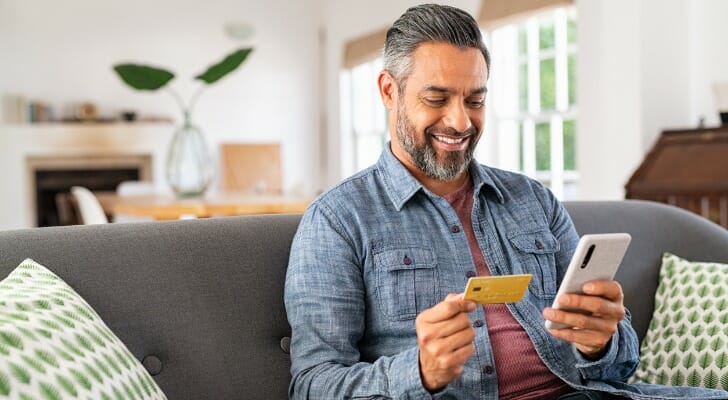 A man reviewing how to set up direct deposit into a savings account.