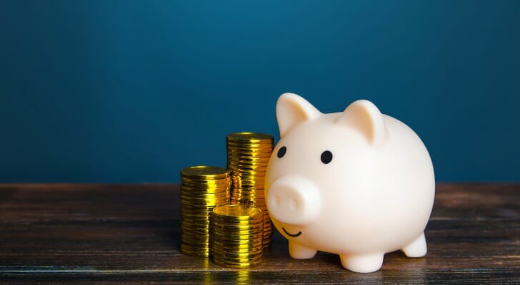 A piggy bank and coins, representing a savings account.