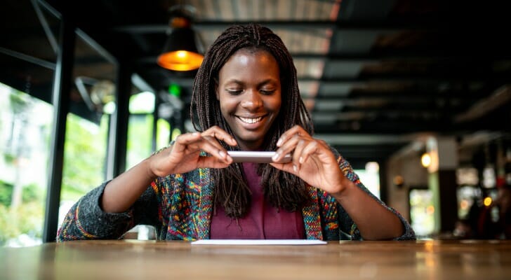 A woman depositing a check with a mobile app.