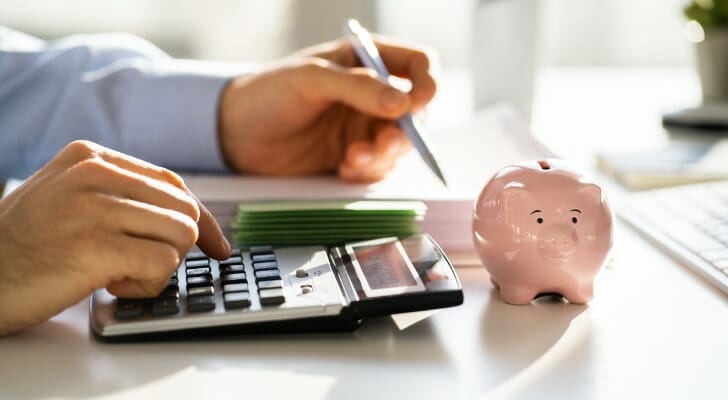 financial-advisor-with-piggybank-SmartAsset