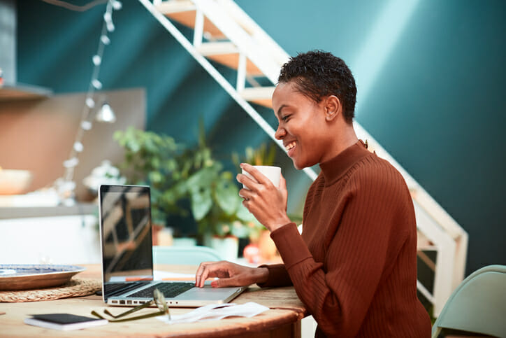 A woman researching if high-yield savings accounts are safe.