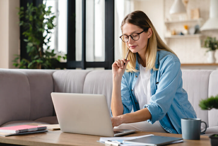 A woman comparing different term deposit accounts.