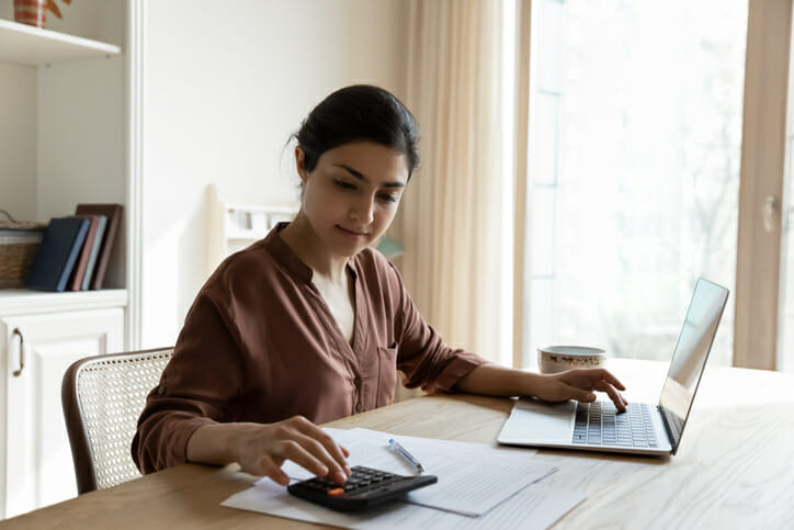 A woman reviewing her finances online.