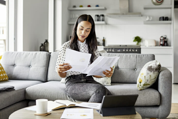 A woman reading her savings account statement.